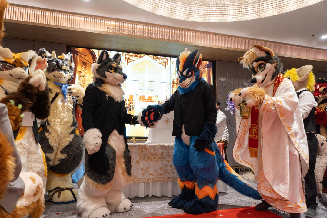 Priest sprinkles Grooms with Holy Water